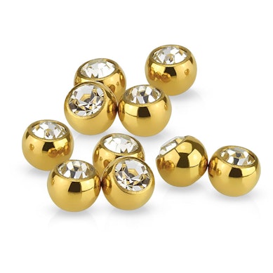 Piercing ball in different colors with bezel-set gem.