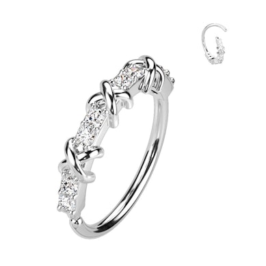 Twist ring with criss-cross design with pavé stones