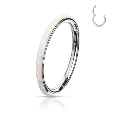 Ring made of titanium with a hinge and opal outer side