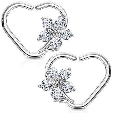 Ear piercing with heart shape and flower charm