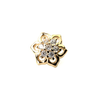 Dermal top made of 14k gold with seven zirconia gems at the centre
